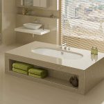 Here, the Arcadia bath is shown undermounted beneath tiles.