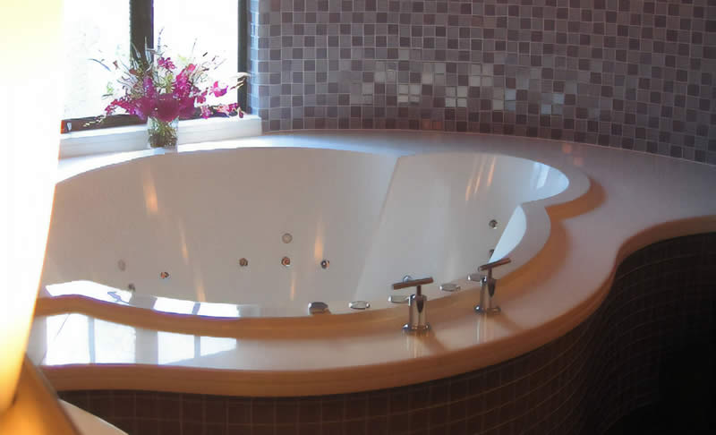 A bespoke luxury bath, also incorporating a custom hydrotherapy system.