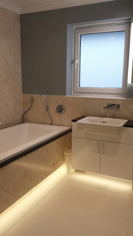 The bath and accompanying units feature attractive under-lighting