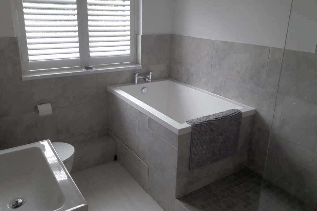 calyx-soaking-tub-worcestershire-1 The Calyx soaking tub, set into a grey tiled surround.