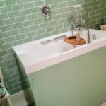 Imersa deep soaking tub with coloured panel