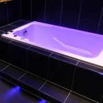 Here, the Nirvana soaking tub is shown semi-sunken into the floor.