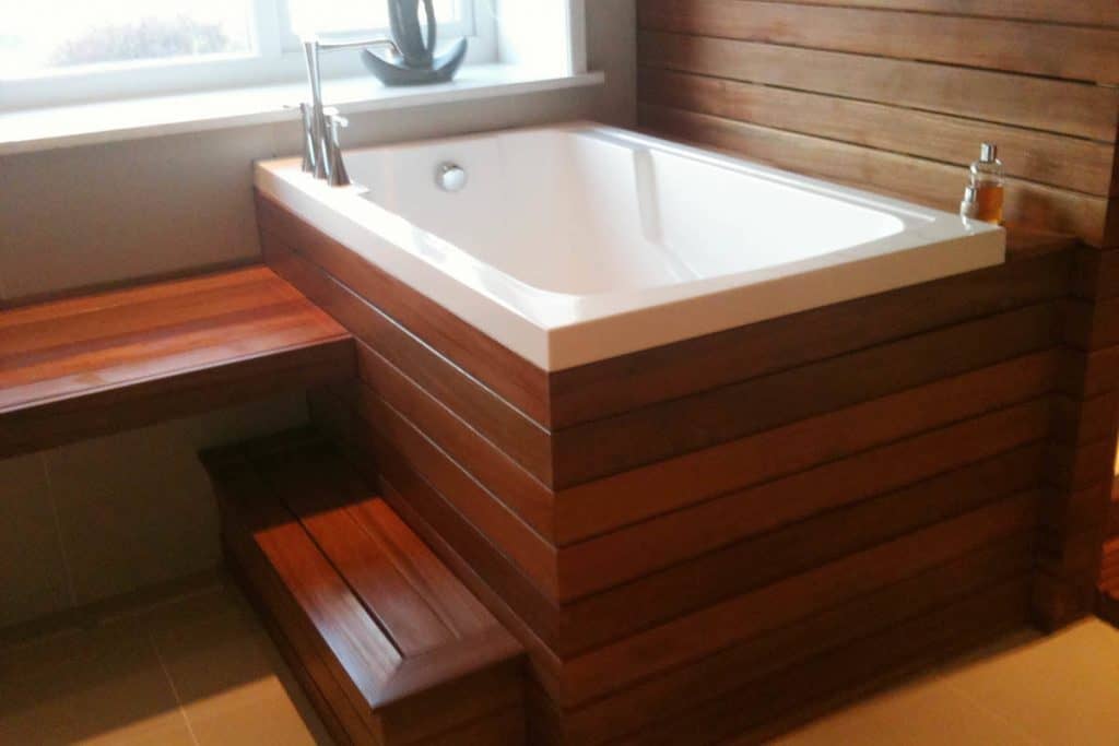 The Nirvana Japanese deep soaking tub in a wooden surround, England, UK
