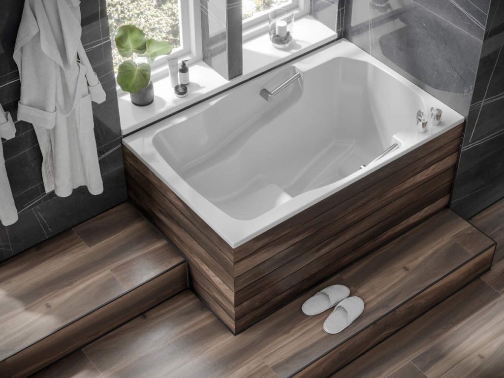 The Takara easy-access deep soaking tub, with wooden surround and step.