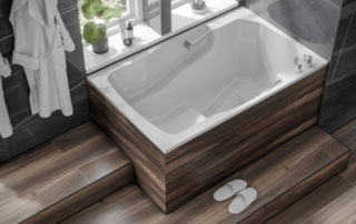 The Takara easy-access deep soaking tub, with wooden surround and step.