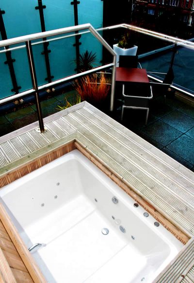 The Xanadu Japanese-style soaking tub, shown outdoor on a penthouse terrace