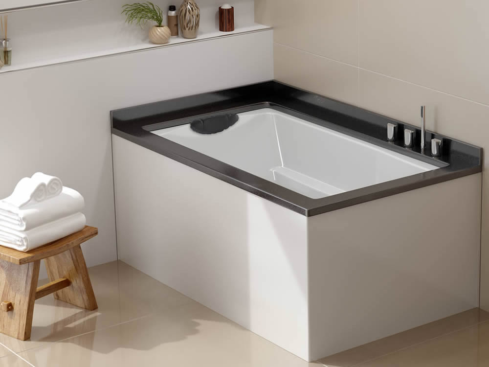 The Yasahiro Japanese style soaking tub, used as a corner bath. Shown undermounted witha Ficore panel.